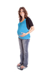 pregnant scales hands on belly