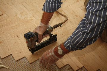 Laying wooden parquety flooring
