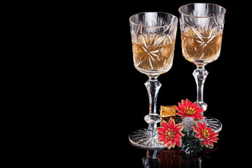 Champagne glasses with Christmas decorations on