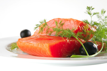smoked salmon on white plate with olives