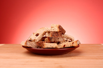 Rusk on red background