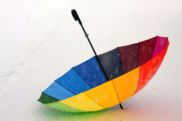 Colorful umbrella in the snow