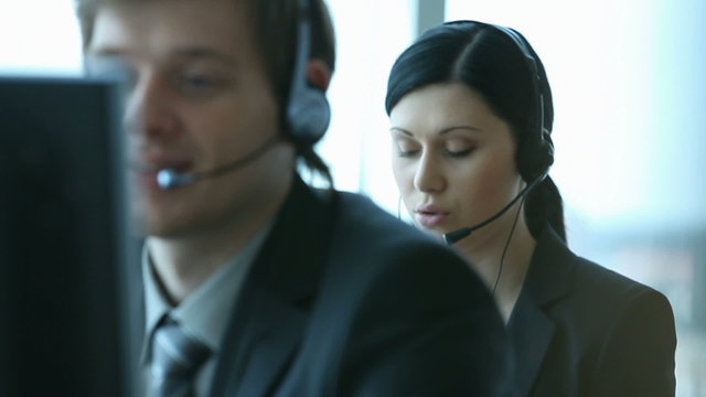 Company representative using headset to talk on the hotline