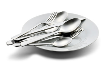 Spoon,fork,and knife on white plate