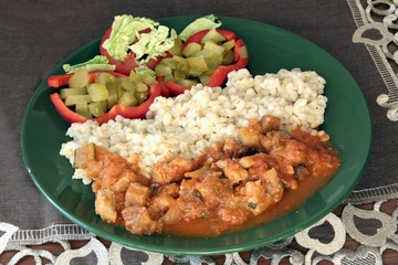 veal meat goulash with hulled barley and salad