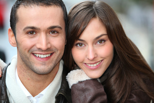 Young couple shopping in town in winter