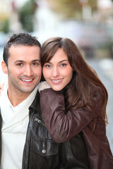 Young couple shopping in town in winter