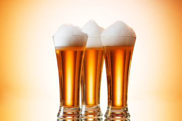 Beer glasses against the colorful gradient background