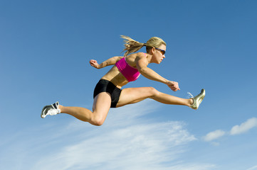 Athlete Jumping Against a Sky Backdrop