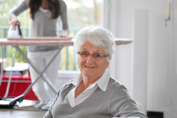 Fototapeta na wymiar Closeup of elderly woman with home help