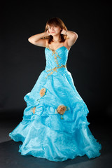 Fototapeta premium The girl in the long blue dress