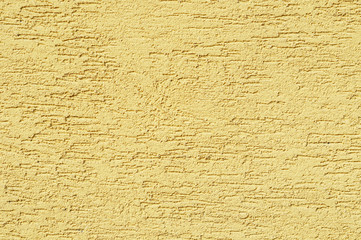 Modern grainy yellow stucco texture