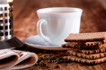 french press, cup of fresh herbal tea and some cookies