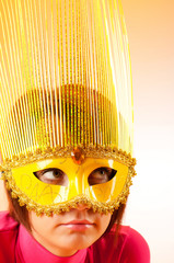 Attractive woman posing in the stylish mask