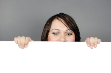 Fototapeta premium Woman with a blank billboard