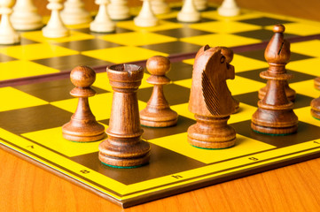 Set of chess figures on the playing board