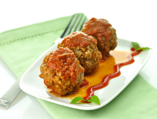 meat balls with tomato sauce on white dish