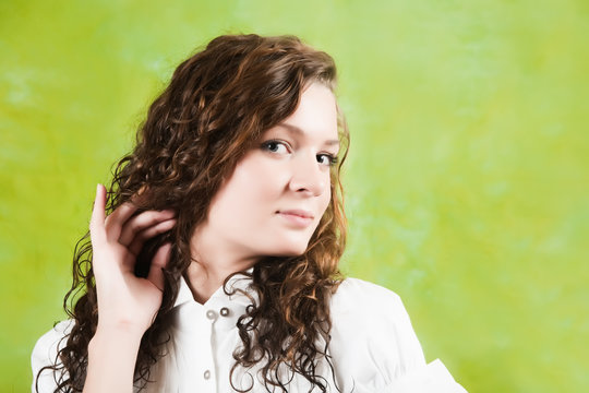 Fototapeta long hair  girl over green background