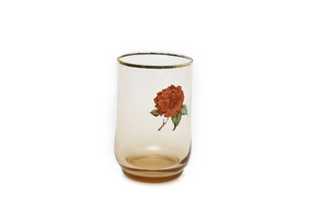 with a glass of rose decoration on white background