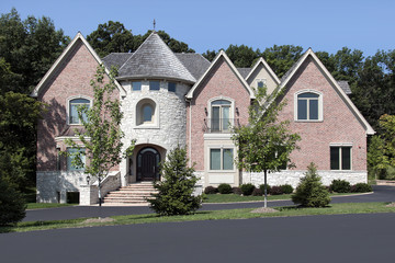Luxury brick home with turret