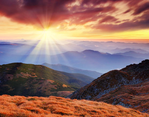 Obraz premium Landscape with a dawn in mountains