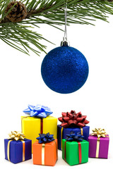 christmas bauble and gifts over a white background