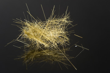 "Pele's hair". Fibers formed when lava cools in the wind.