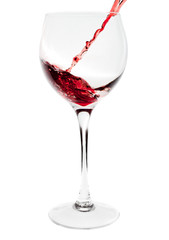 Red wine pouring into wine glass