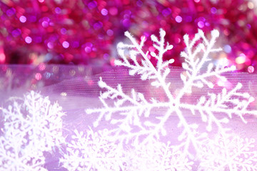 Obraz na płótnie Canvas holiday snowflake on violet background