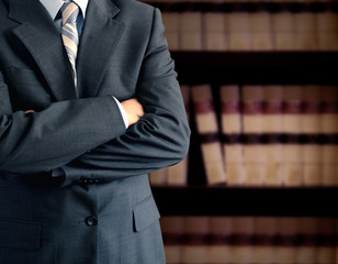 Businessman in front of books