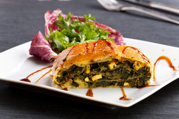 slice of a spinach strudel on a plate