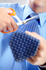 Businessman cutting the tie