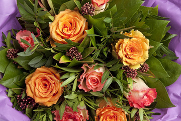 Bouquet of pink and orange roses full frame