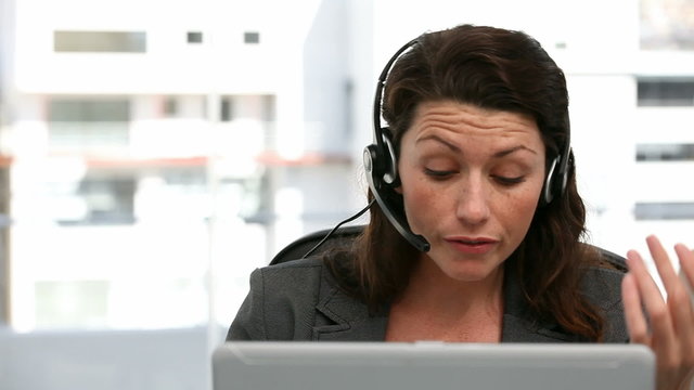 Angry representative on the phone in a call centre