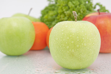 Green apple and tangerine