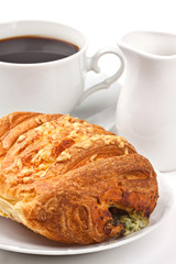 Breakfast: coffee and bun with cheese and spinach