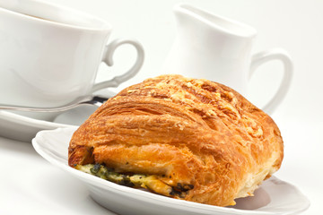 Breakfast: coffee and bun with cheese and spinach