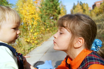 The girl wishes to kiss the kid