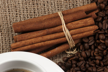mug coffee and cinnamon on bagging