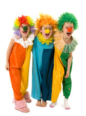 Three funny little clowns in colorful costumes