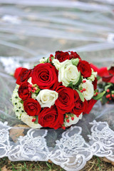 Bouquet with roses for the bride on veil