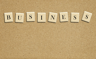 Business word on cork board background