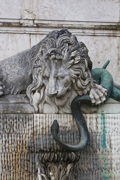marble lion and bronze snake
