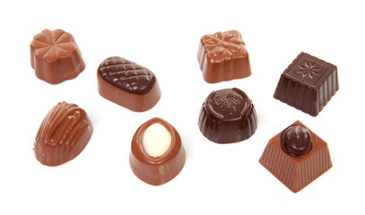 chocolate bonbons over white background