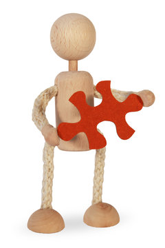 Eine Figur h&auml;lt ein Puzzlest&uuml;ck