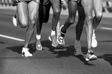 Marathon runners running. Legs close up
