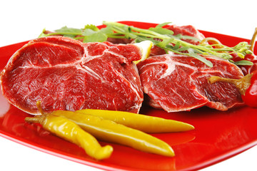 raw meat chunk on red plate