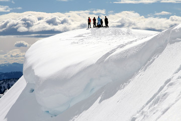 People on Snow-Covered Hill