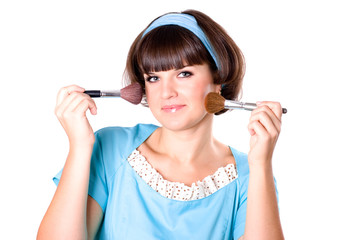 brunette woman with two make-up brushes
