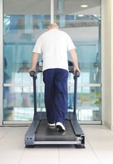 Fototapeta na wymiar Elderly man in gym